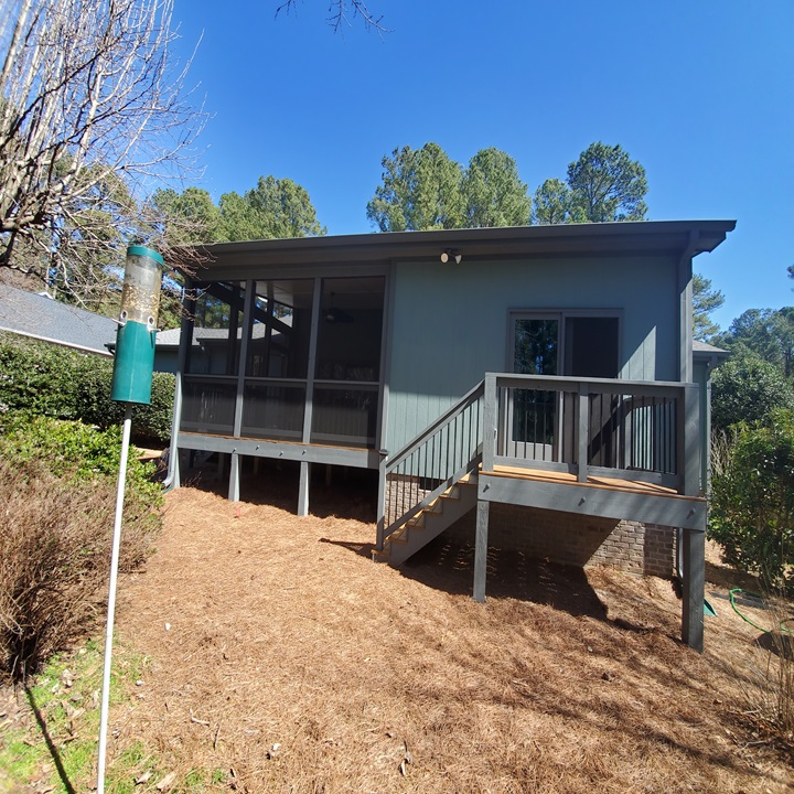 Rear home addition with elevated deck and modern exterior, showcasing a custom residential expansion in Cary, NC